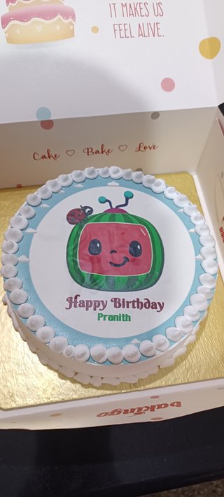 White n Blue Round Cocomelon Theme Birthday Cake