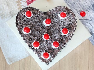Top View of Heart Shaped Black Forest Cake with Cherry Toppings