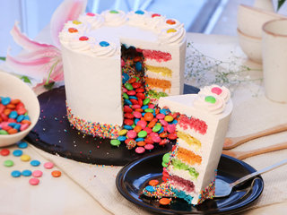 Sliced View of Rainbow Gems Pinata Cake 1Kg