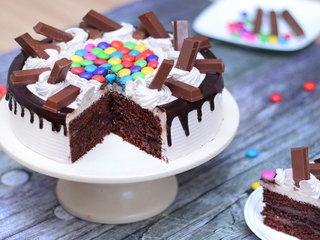 Sliced View of Delicious Kitkat Gems Cake