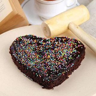 Top View of Heart Shaped Chocolate Pinata Cake For Valentines Day with Hammer