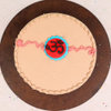 Top View of Chocolate Cake with OM Rakhi on it